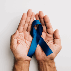 Men's Mental health Men's hands holding a blue ribbon for men's mental health awareness